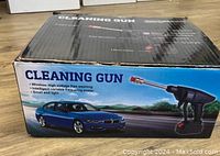 Box of the cleaning gun showing product name, image of the black cleaning gun, and list of features including wireless high voltage free washing, intelligent variable frequency motor, small and light.