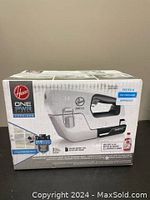 Front side of the sprayer box showing Hoover ONEPWR branding and product image with authority and warranty info.