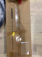 Closed cardboard box labeled ASNG073 Fabric 13 Drawer High Storage Cabinet