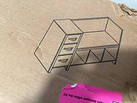 Diagram sketch of the kids reading nook organizer showing bench and drawers layout on cardboard box.