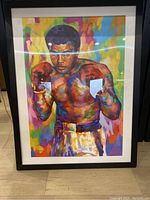 Full front view of framed painting showing entire image, frame, and mat.