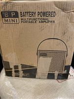 Cardboard box with BP Mini branding and product info 'Battery Powered Multifunctional Portable Amplifier'.