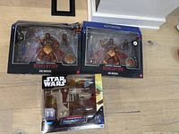 Two Masters of the Universe Revelation King Grayskull figures and one Star Wars MicroGalaxy Squadron Republic LAAT boxed vehicle toy.