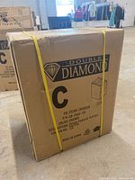 Photo of factory sealed Double Diamond file cabinet box showing branding, dimensions, and model information.