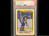 Front of 1990 O-Pee-Chee Mario Lemieux hockey card graded NM-MT 8 in PSA holder showing player in Penguins uniform.