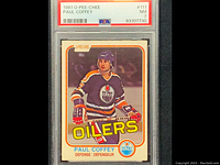 Front of the 1981 O-Pee-Chee Paul Coffey rookie card graded PSA NM-7 showing player in Oilers uniform on ice with hockey stick, with PSA label and grade visible.