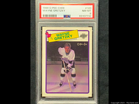 Front of graded Wayne Gretzky hockey card in protective PSA case showing grade NM-MT 8