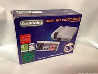 Box of CoolBaby HDMI HD Video Game Console showing branding, HDMI 1080p support, and 600 built-in games.