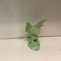 Front view of the glow in the dark Skylander figure showing detailed face, wings, claws, and base.