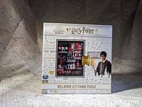 Front view of the sealed box showing Harry Potter branding and Bellatrix Lestrange puzzle image