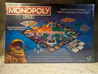 Image of Monopoly Space board game front box with space suit figure and board game graphics, factory sealed.
