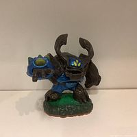 Front angle of Skylanders tree character figurine with blue armor and green base.