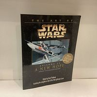 Front cover of the book titled 'The Art of Star Wars Episode IV A New Hope' featuring Star Wars logo and spacecraft image
