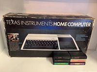 Original box front showing "Texas Instruments Home Computer" branding and TI-99/4A console image