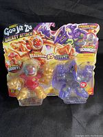Two Heroes of Goo Jit Zu Galaxy Attack toys in original packaging