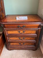 Front view of one nightstand showing overall design and finish