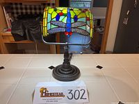 Front view of lamp showing shade pattern and base