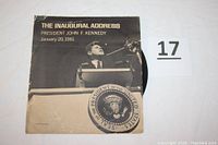 Dust jacket showing image of President John F. Kennedy at podium delivering the inaugural address. Shows some wear but overall very good condition.