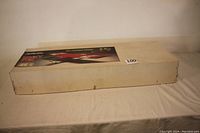 Closed box of Model Tech Lucky Stik R/C Trainer Model Airplane Kit, white with label.