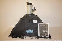 Full view of Flashpoint monolight with Savage softbox hood, cables, and manual displayed