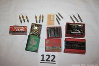 Various pen tips displayed on a white surface including boxed and loose Speedball pens and E. Esterbrook & Co. pen tips.