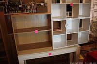 White table, brown bookcase, and two white storage cubes stacked and arranged together showing front and top views.