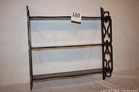 Full view of wooden wall shelf including both shelves and side details.