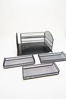 Front perspective of black metal mesh office file organizer with three removable drawers spread out in front, showing the unit and its components.