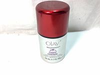 Front view of Olay Regenerist Instant Fix Wrinkle Revolution Complex Primer Plus in a 50ml silver bottle with red cap showing product name and volume.