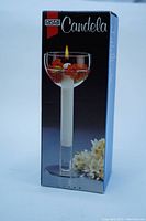 Box front showing Rastal Candela crystal glass candle goblet model and product image with candle lit inside.