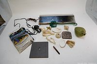 Overview photo showing all items in the lot including shells, filter, green net, light cover, and power cord