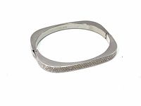 Image showing the Swarovski square silver-tone bangle bracelet laying flat, crystals visible on one side, clean condition.