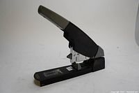 Front angle view of the black and gray Swingline heavy-duty stapler on a white surface.