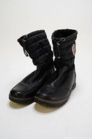 Front angled view of black Blondo winter boots with leather foot and quilted synthetic shaft showing adjustable drawstring and rubber sole.