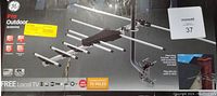 Box image of GE Pro Outdoor Antenna 1080 HD showing antenna with multiple aluminum elements, mounting bracket and installation instructions, highlighting features for HD TV, local channels up to 130 stations within 70 miles, and 4K support.