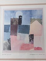 Framed abstract watercolor print by Paul Klee featuring geometric shapes and muted colors with a round white shape in the background.