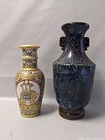 Side-by-side view of both Asian vases showing size contrast and overall appearance.