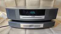 Front view of Bose Wave Music System on top of multi-CD changer