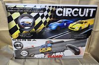 Front view of the Litehawk Corsa race set box showing the slot cars on the track and branding with track length information.