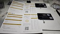 GRA grading report documents laid flat showing details of moissanite certification