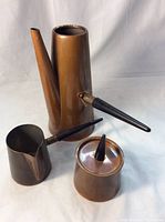 All three pieces of the copper coffee set arranged together on white background, showing sizes and details.