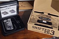 Both systems displayed side by side in open packaging on tabletop