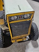 Front view showing radiator grille, headlights and International Harvester badge