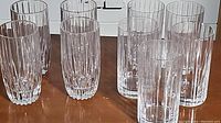 Six clear faceted glass tumblers arranged in two rows