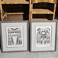 Pair of framed black and white Peter Kappertz prints leaning against wicker shelves showing overall lot contents.