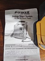 User's manual and warranty sheet for Power On Board Jump-Start System 12 Volt DC Power Supply