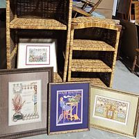 Four frames displayed leaning against wicker shelves, showing variety of retro art prints
