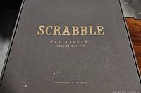 Photo of the grey box lid with Scrabble Pottery Barn Deluxe Edition branding