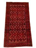 Full top view of rug showing overall geometric pattern and wear