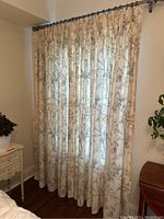 Full view of four curtain panels hung on rod showing pattern, color, length